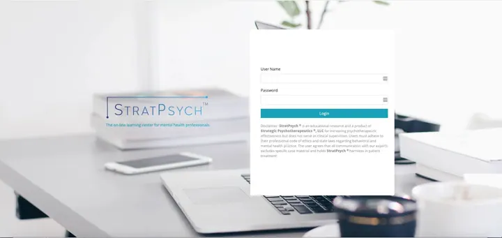The StratPsych login screen on a laptop